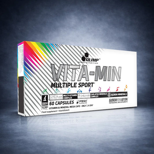 Boîte Vita‑Min Multiple Sport Olimp Nutrition 60 capsules posée sur fond studio gris dégradé premium, visuel e‑commerce santé, énergie et performance sportive.

